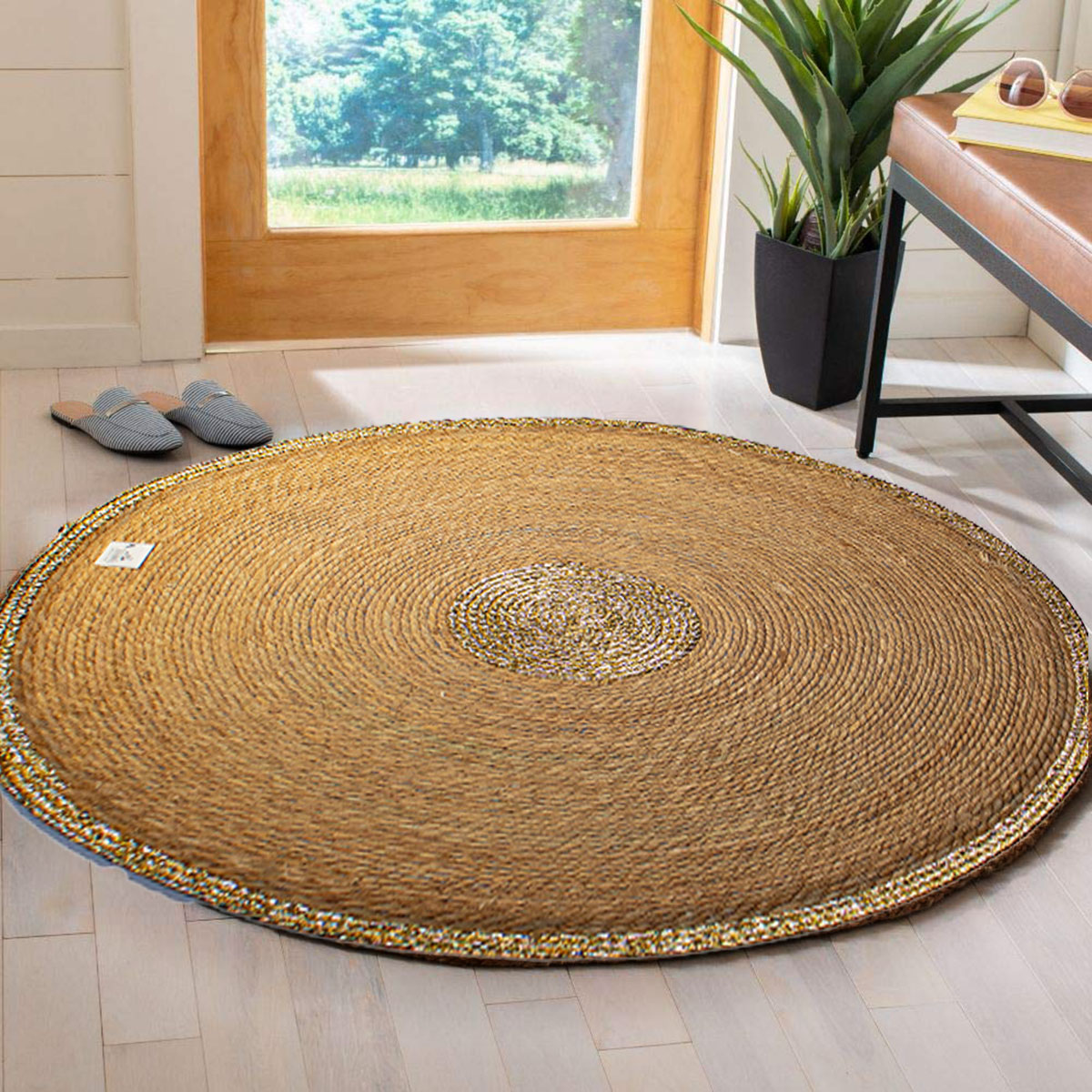 A circular straw mat with a traditional design for floors & tables ...